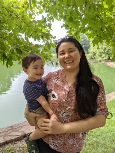 Elizabeth K., owner of Acorn Pals, with child